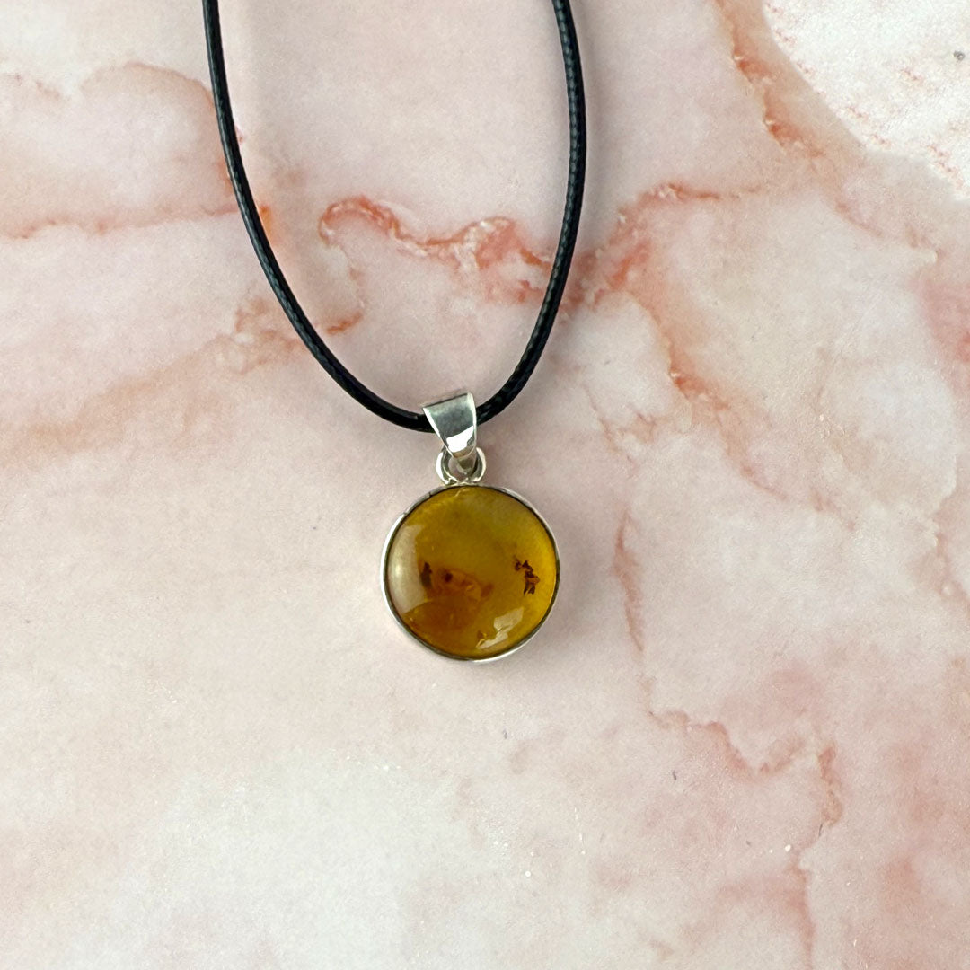 Round Amber Pendant set in Sterling Silver