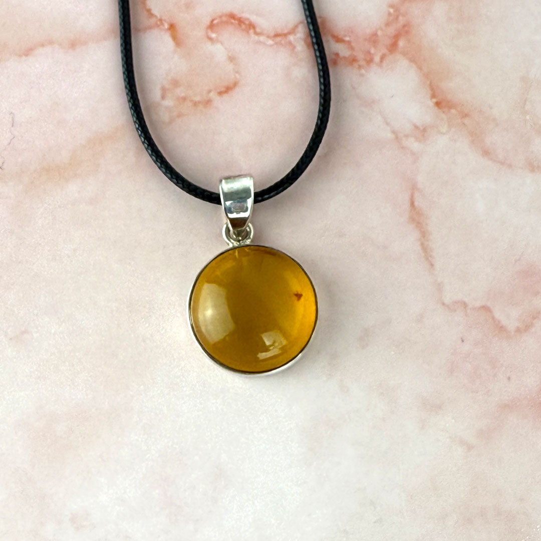 Round Amber Pendant set in Sterling Silver